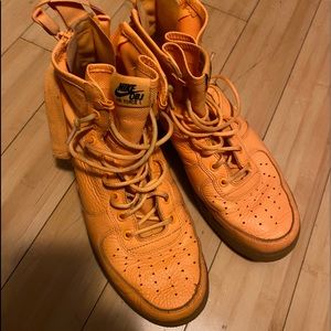 yellow Nikes with zip up back